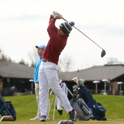 Chris D’Alessandro carrying through on a drive at the golf range