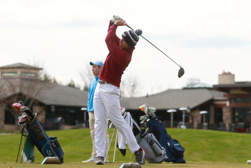 Chris D’Alessandro carrying through on a drive at the golf range
