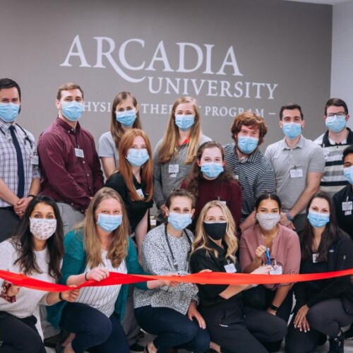 Masked gathering of students for Students at the ribbon cutting for the Pro Bono Clinic