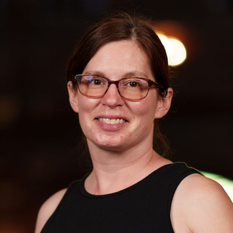Photo of Jennifer Smull, a middle-aged woman with brown hair and glasses