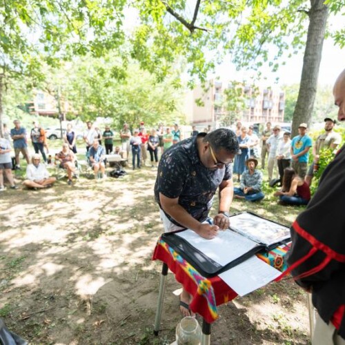 Dr. Martin signs the treaty of renewed friendship with the Lenape Nation of Pennsylvania in outdoor ceremony