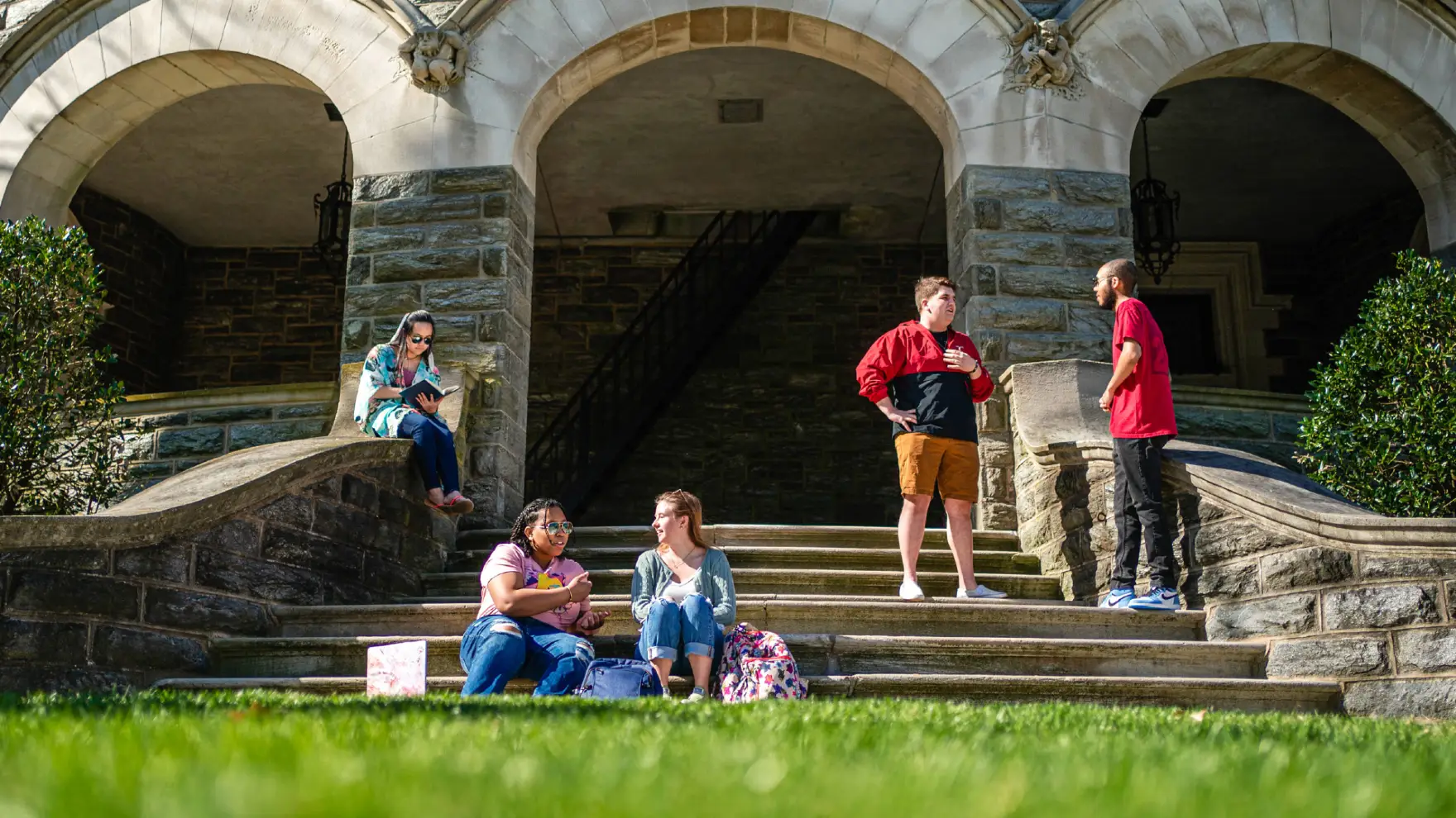 Students gather on the steps of Grey Towers Castle.