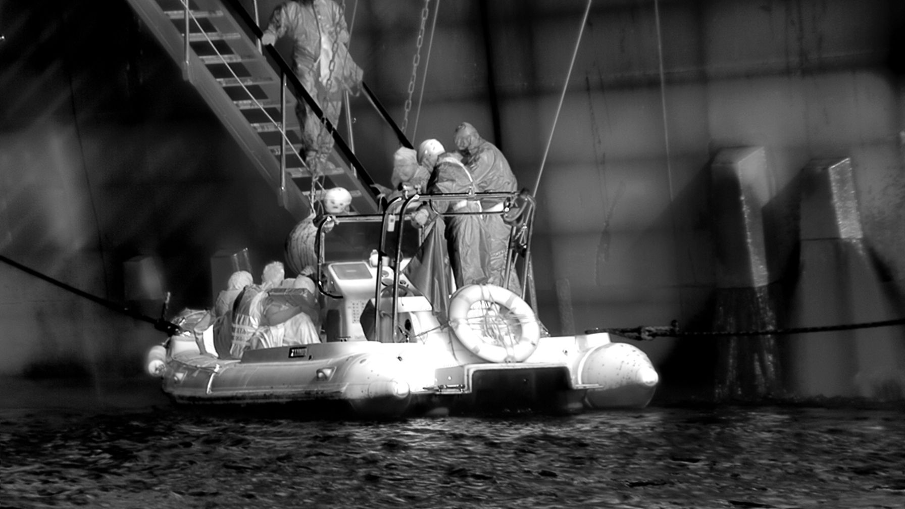 a photograph of a group of people on a small motorized boat