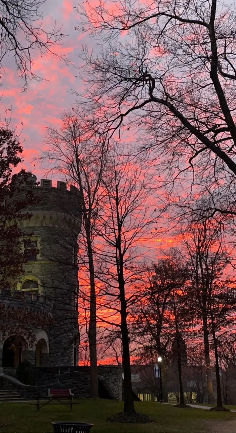 A pink and purple sky behind Grey Towers Castle