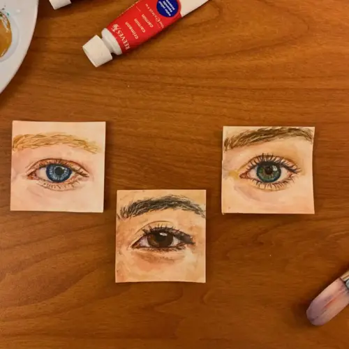 Watercolor paintings of three human eyes