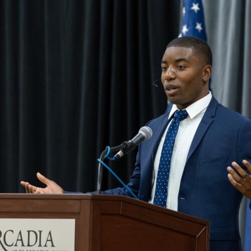 Author Kareem Rosser talks to a crowd in the Great Room