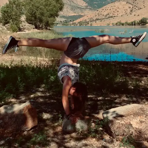 Amellia McGuire Matheny demonstrates her dance ability with a handstand split