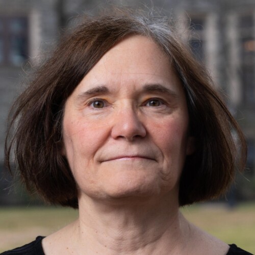 The headshot of Patricia Jenners with a blurred castle background