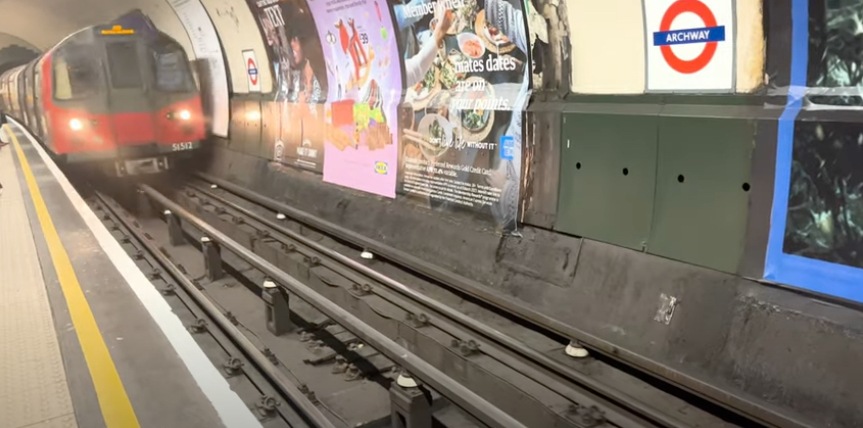 A photo a train arriving at their station in a subway