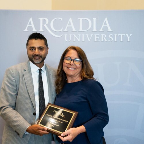 Lisa Stephens receives award from President Ajay nair
