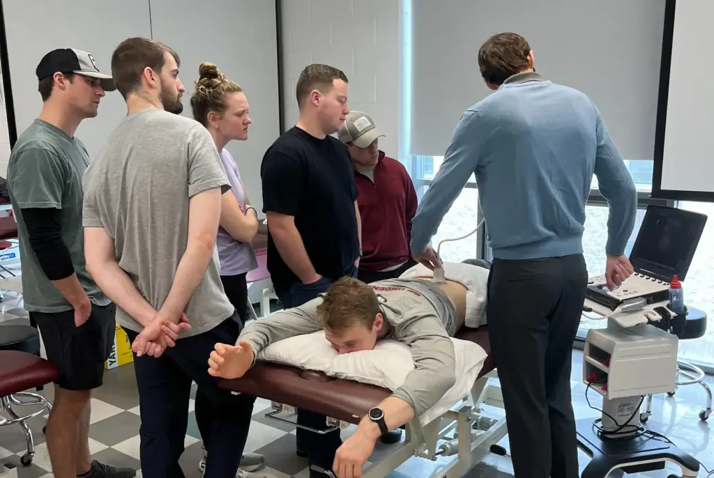 Physical Therapy students working with a patient