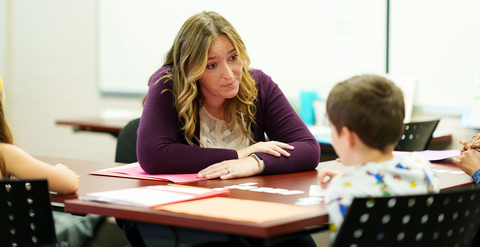 Arcadia student teaching child.
