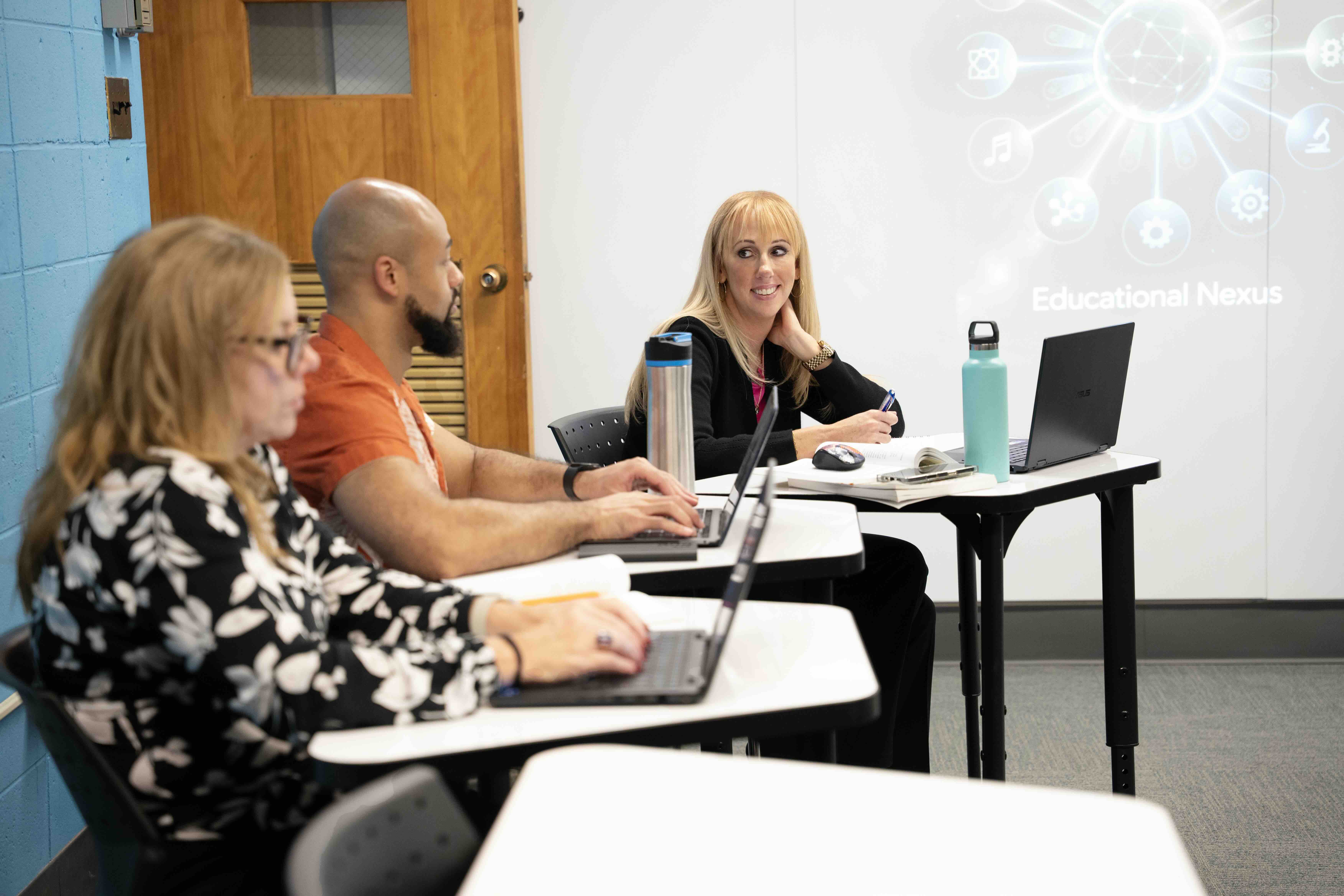 Students in the School of Education discuss classroom topics.