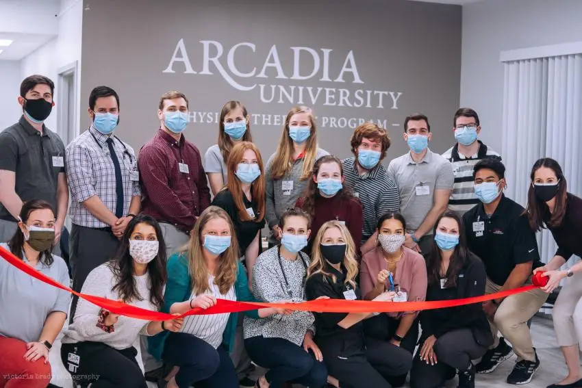 Masked gathering of students for Students at the ribbon cutting for the Pro Bono Clinic