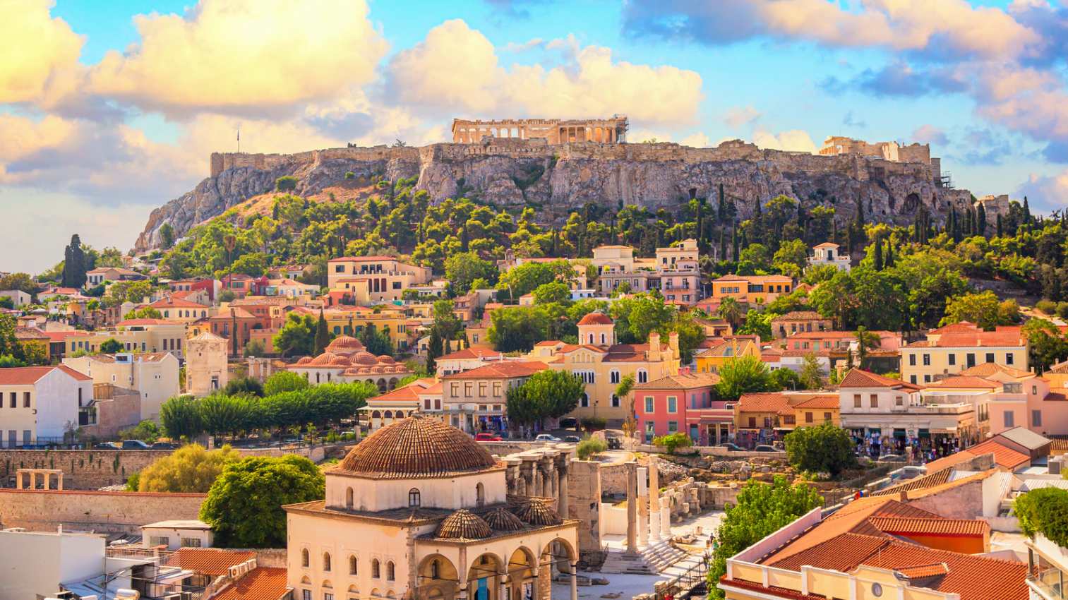 Skyline of Athens with Monastiraki square and Acropolis hill during sunset. Athens, Greece