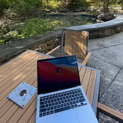 A laptop on a table by Easton Pond.