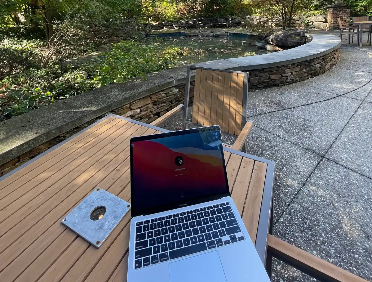 A laptop on a table by Easton Pond.