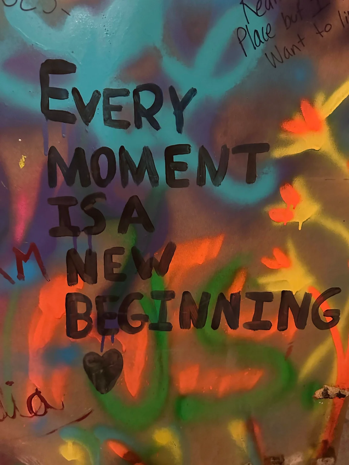 Artwork reading "Every moment is a new beginning"