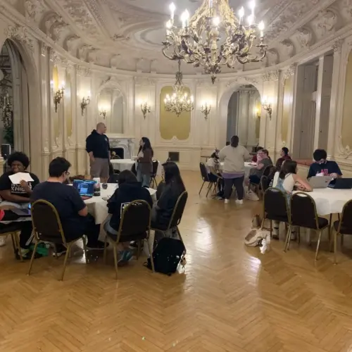 Students gathered in the Rose Room for rehearsals.