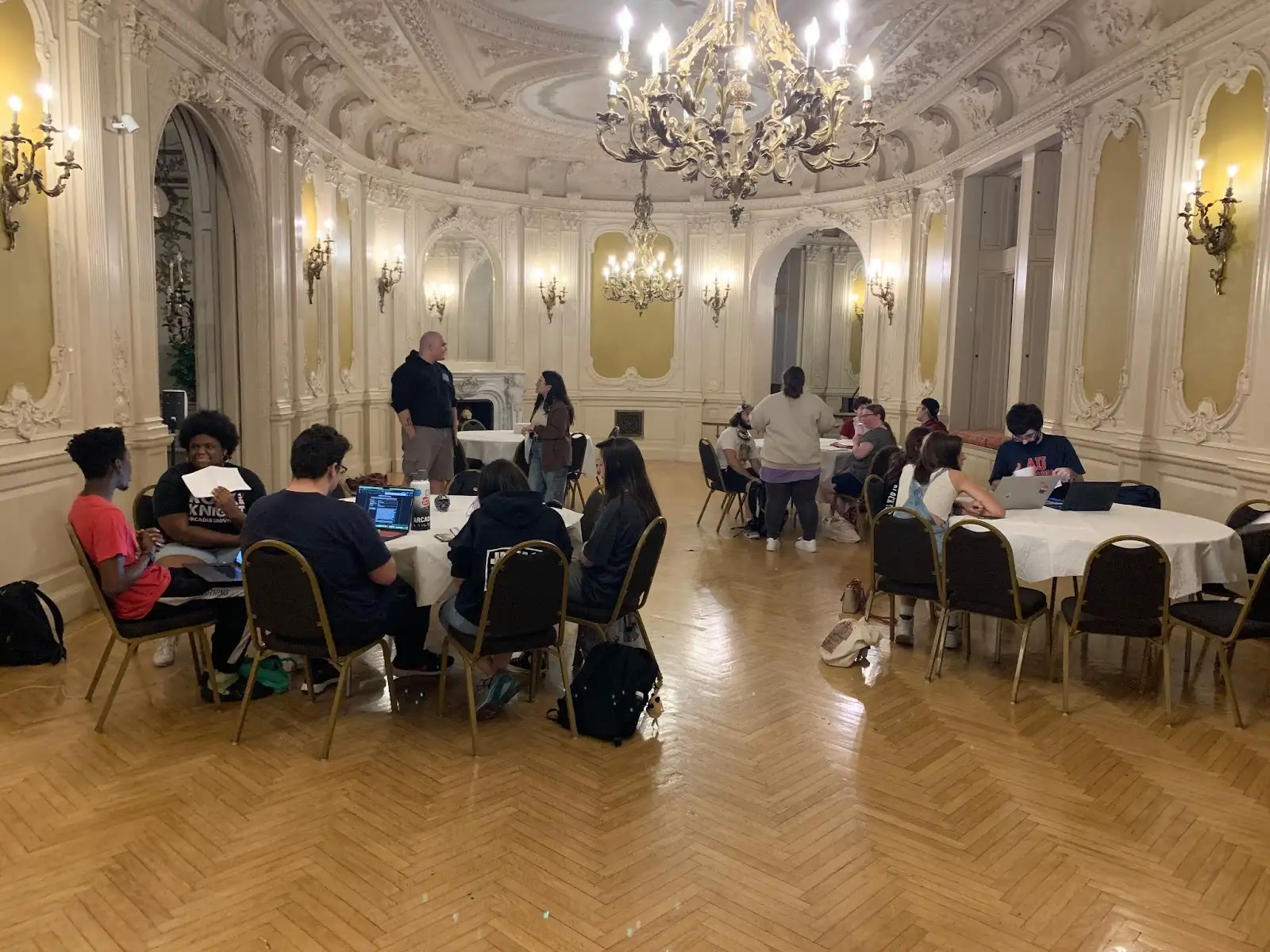 Students gathered in the Rose Room for rehearsals.