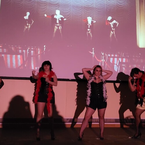 Rocky Horror cast members on stage.