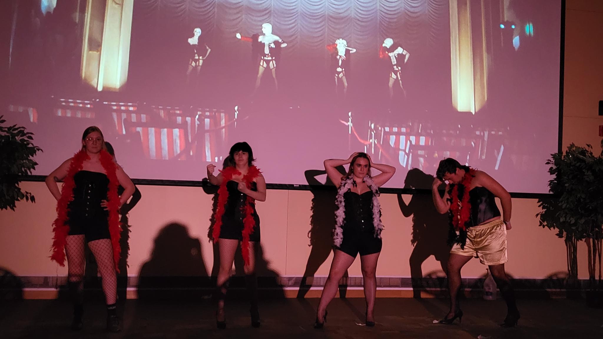 Rocky Horror cast members on stage.