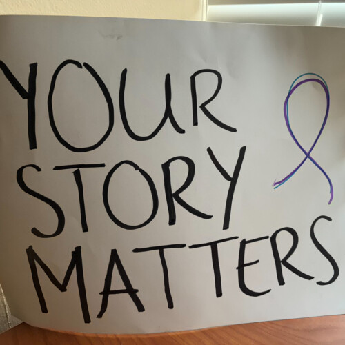 A sign reading "Your Story Matters."