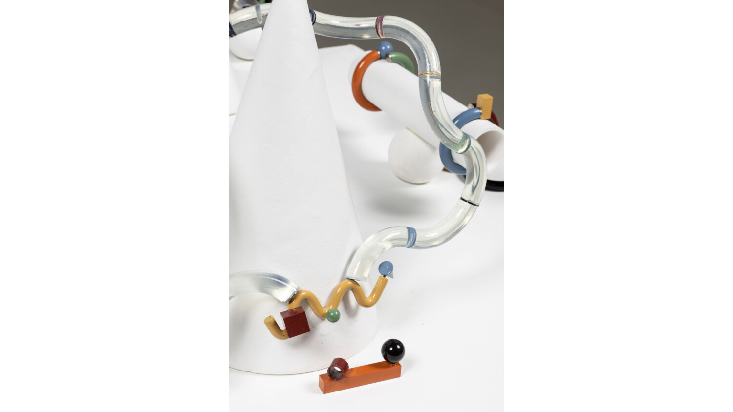 A modern sculpture of a white cone, tubes, squiggles, and other shapes by Ryan Connor '22.