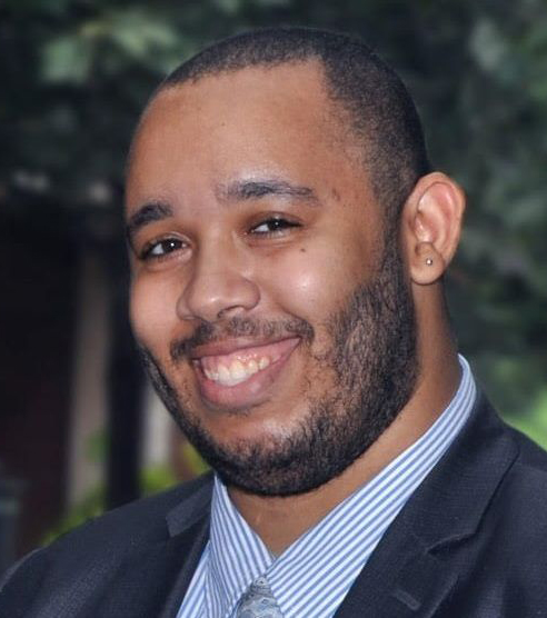 Dr. Christopher Varlack smiles in a protrait photo.