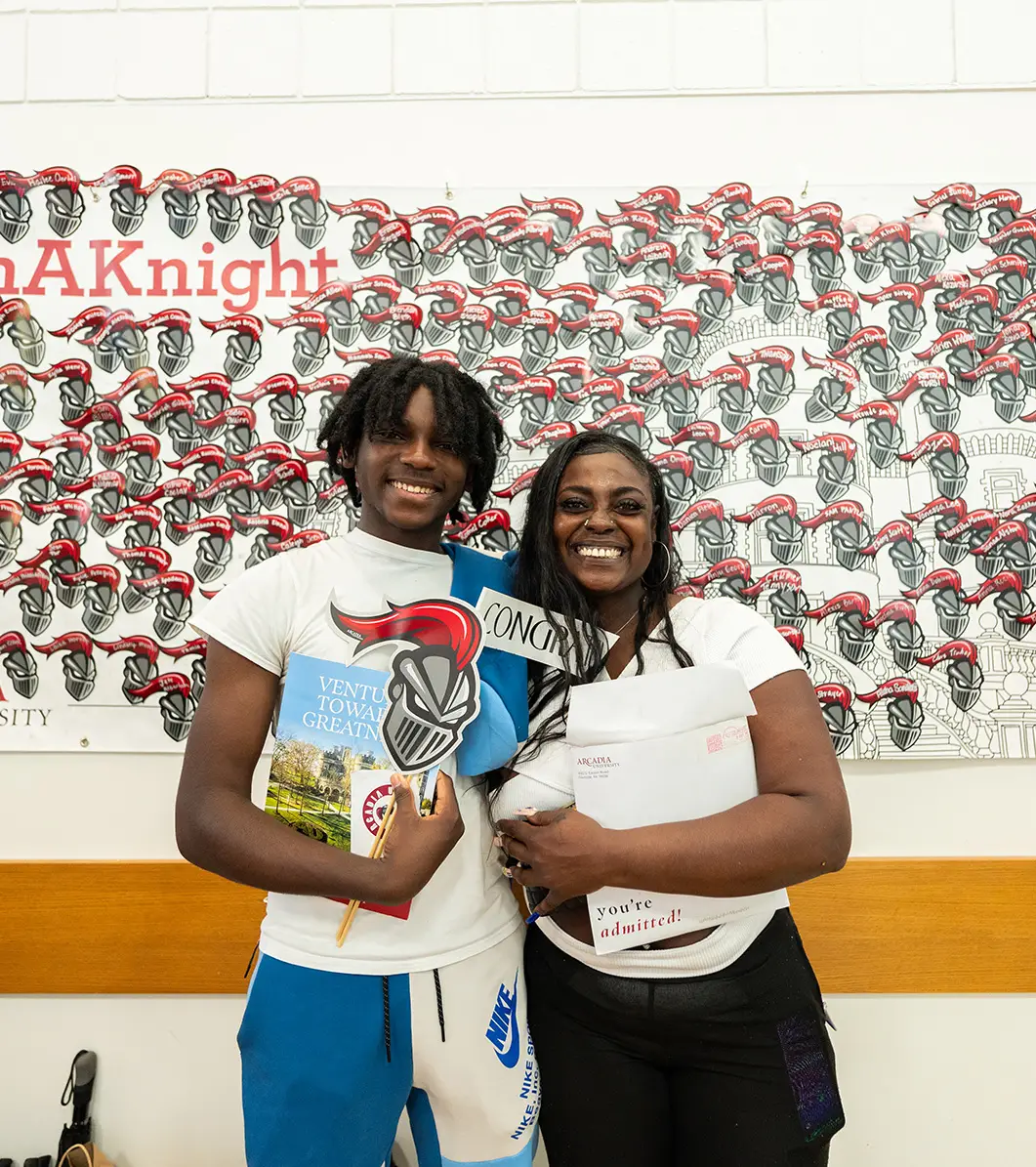 A Mother and her son pose during a Scarlet and Grey event.