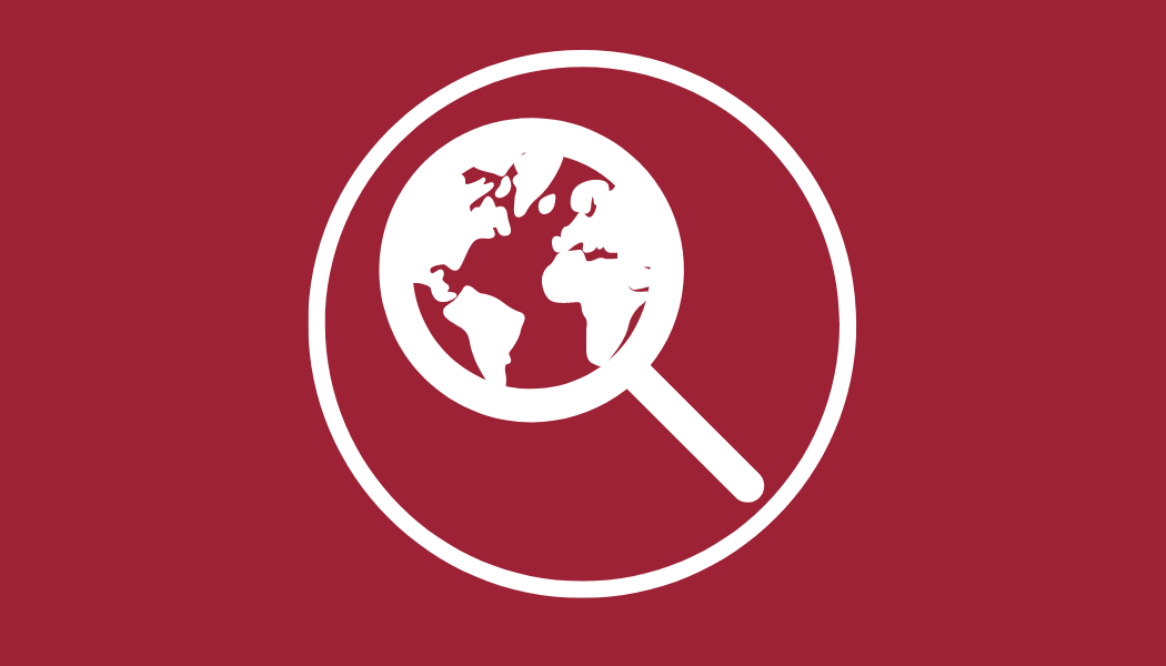 A graphic in red showing a magnifying glass of the world.