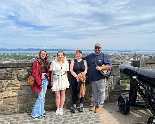 Arcadia students and a faculty member take in the view over Edinburgh, Scotland.