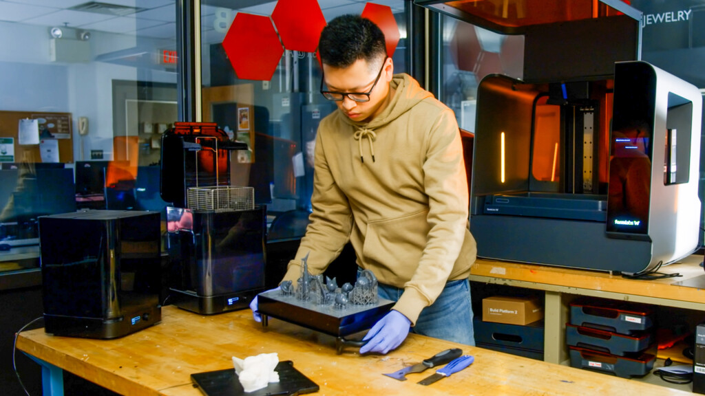 An art student works on a project in the digital and fabrication lab.