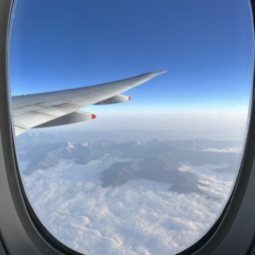 A photo taken out the window of a plane.