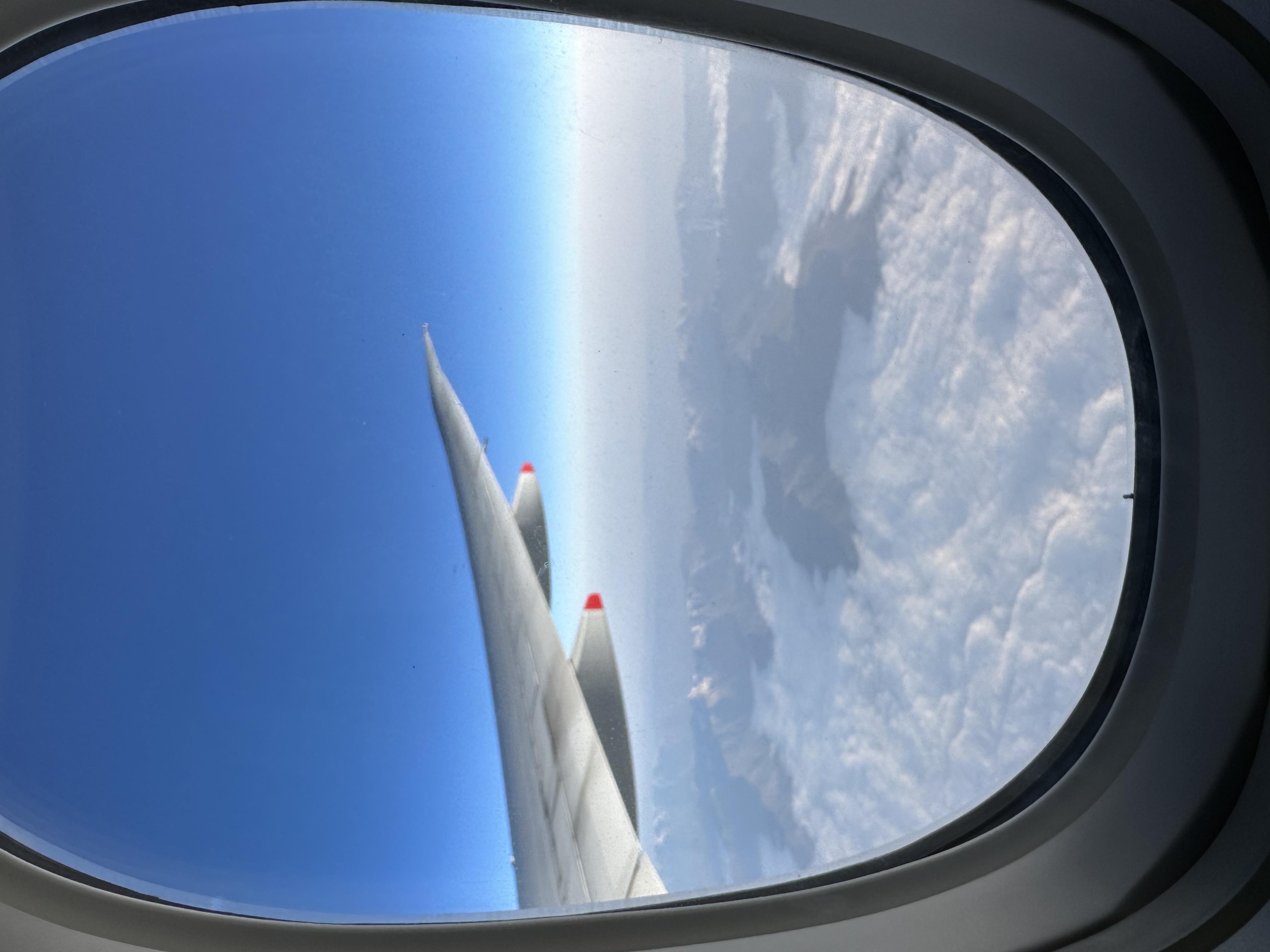 A photo taken out the window of a plane.