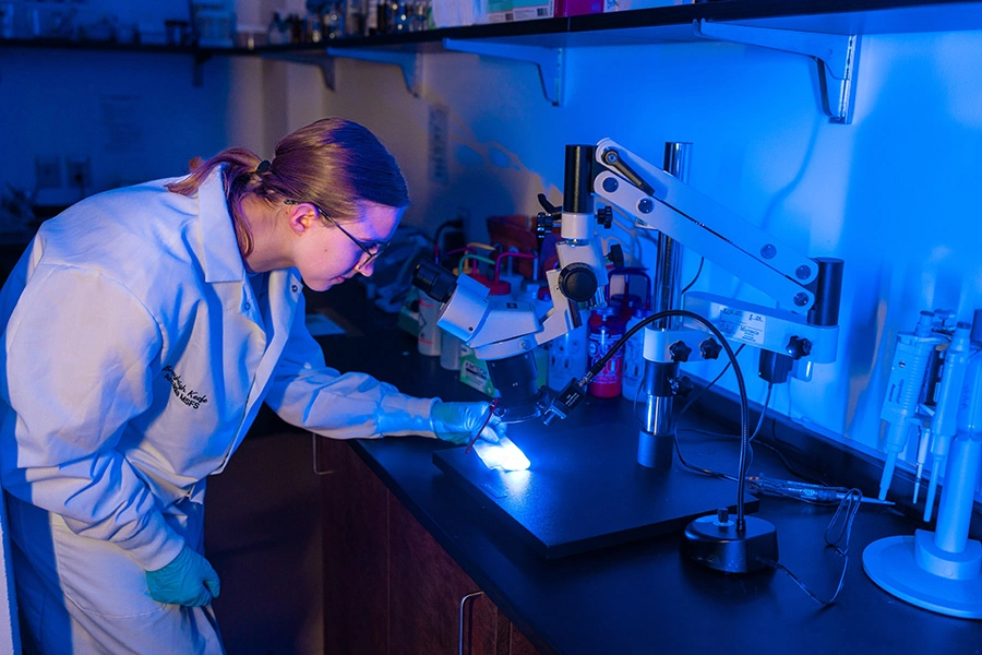 A student works in a lab with Confirmatory Testing.