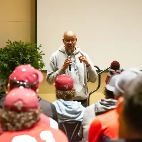 Byron Motley speaking to students on the baseball team.
