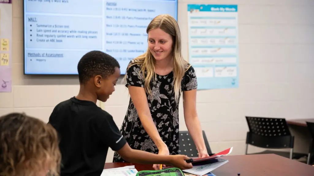 A student teacher interacting with kids