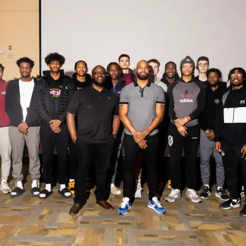Nafis Ricks with student athletes.