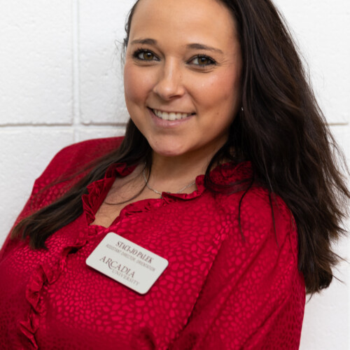 Staci Jo Palek Assistant Director of Student Engagement at Arcadia University smiles on campus.
