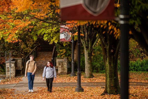Students walking on campus in the Fall