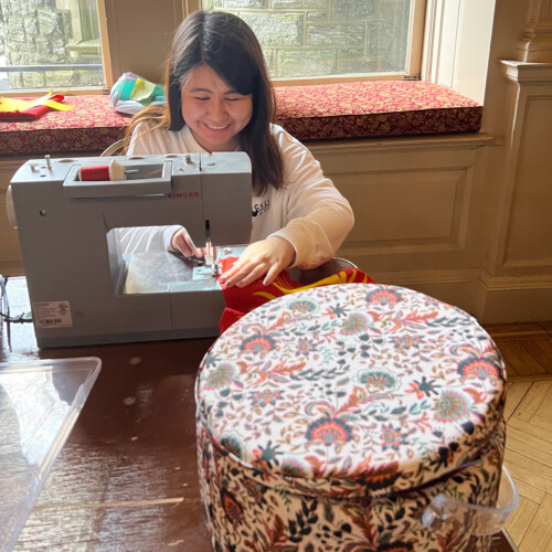 Nelly Tyncherova ’26 hard at work sewing the flag of Kyrgyzstan, her home country