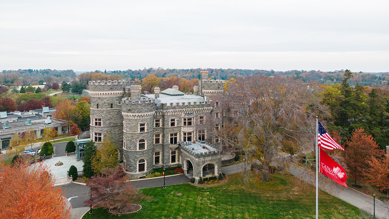 Arcadia's castle on a fall day with flags.