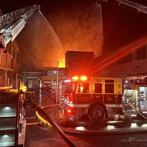 A Glenside Fire Company truckin front of SPS Industries in Jenkintown, which is actively burning