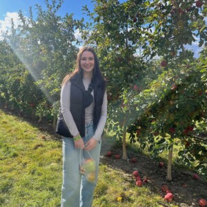 Santina Kobierecki ’25 in an apple orchard.