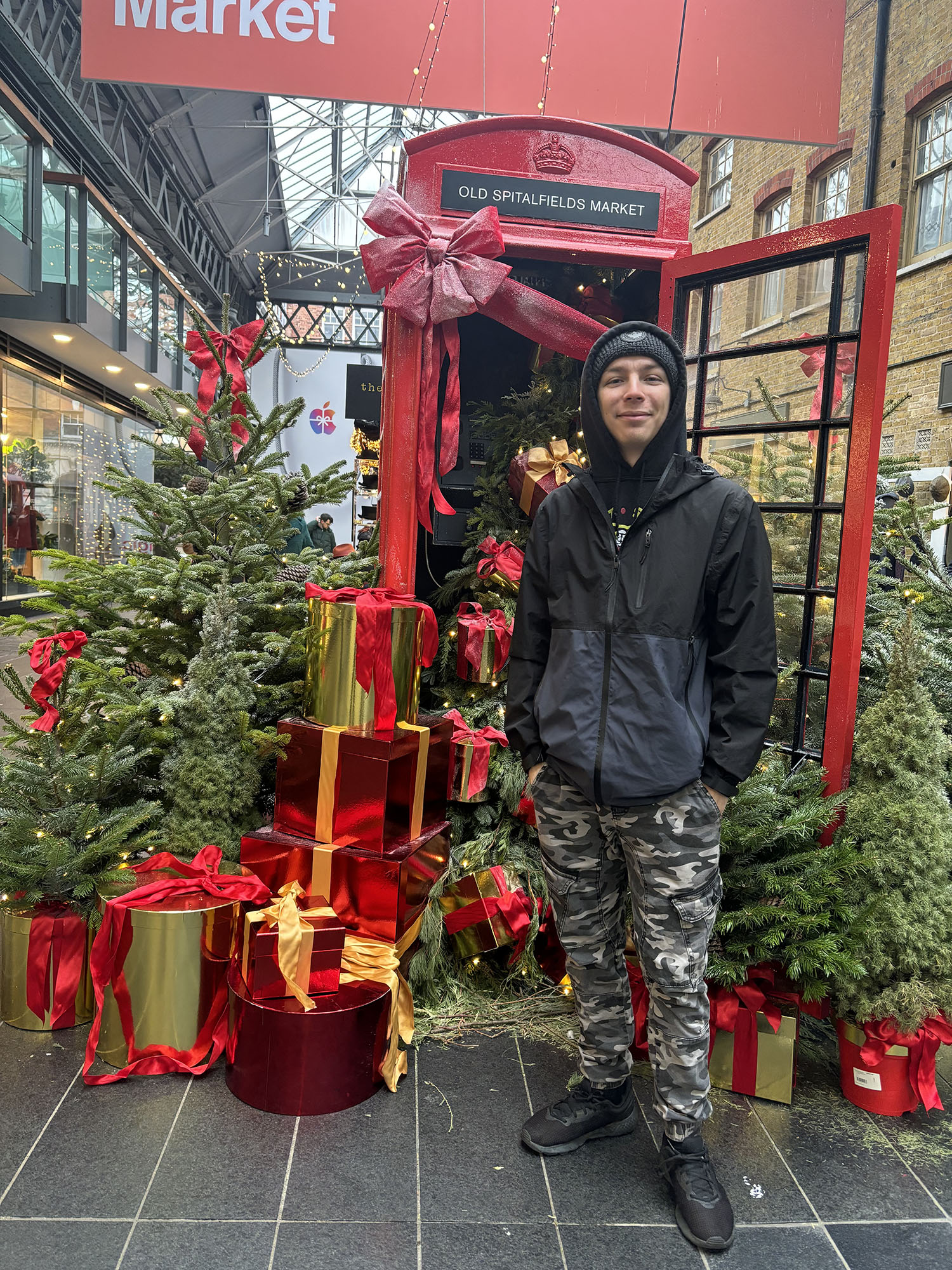 Cody Jellison ’25 in front of a phone booth.