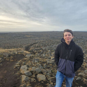 Cody Jellison ’25 with a landscape of rocks.