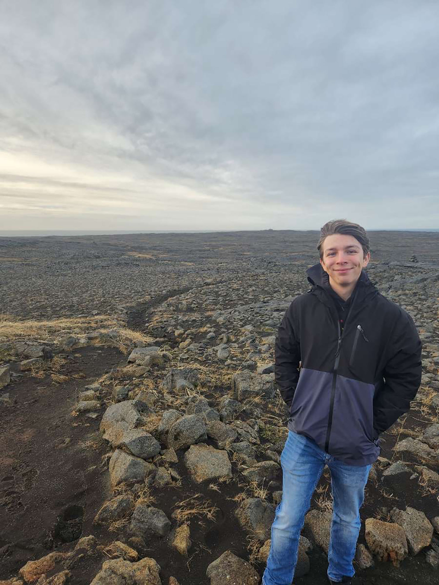 Cody Jellison ’25 with a landscape of rocks.