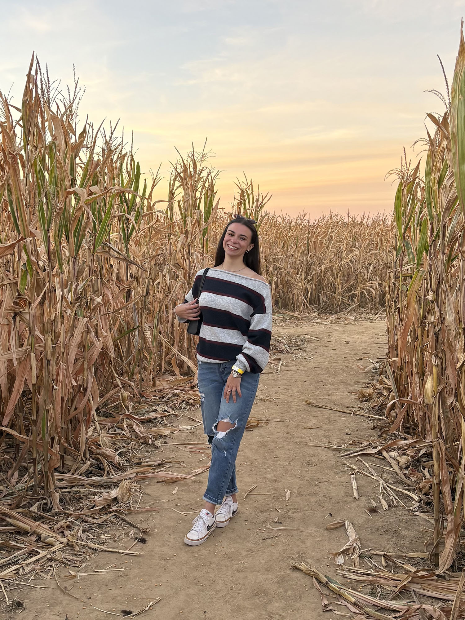 Ninah Malleo ’25 in a cornfield.