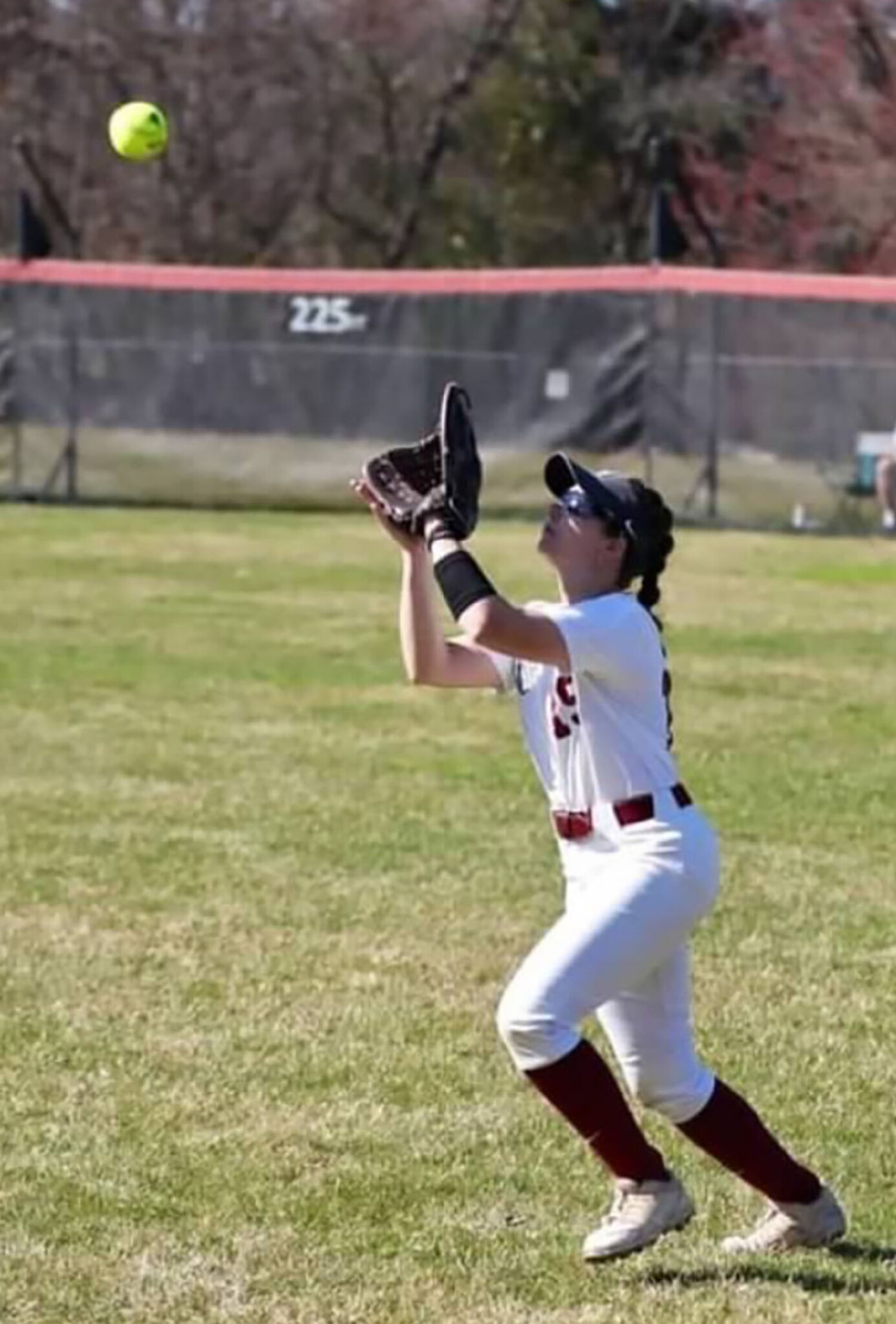 Zoey Ritter ’25 catching a softball.
